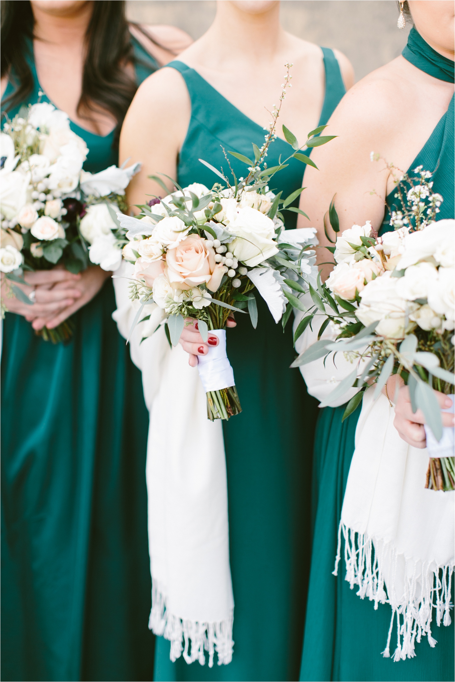 Jade green bridesmaid dresses with neutral winter florals by Sullivan Owen