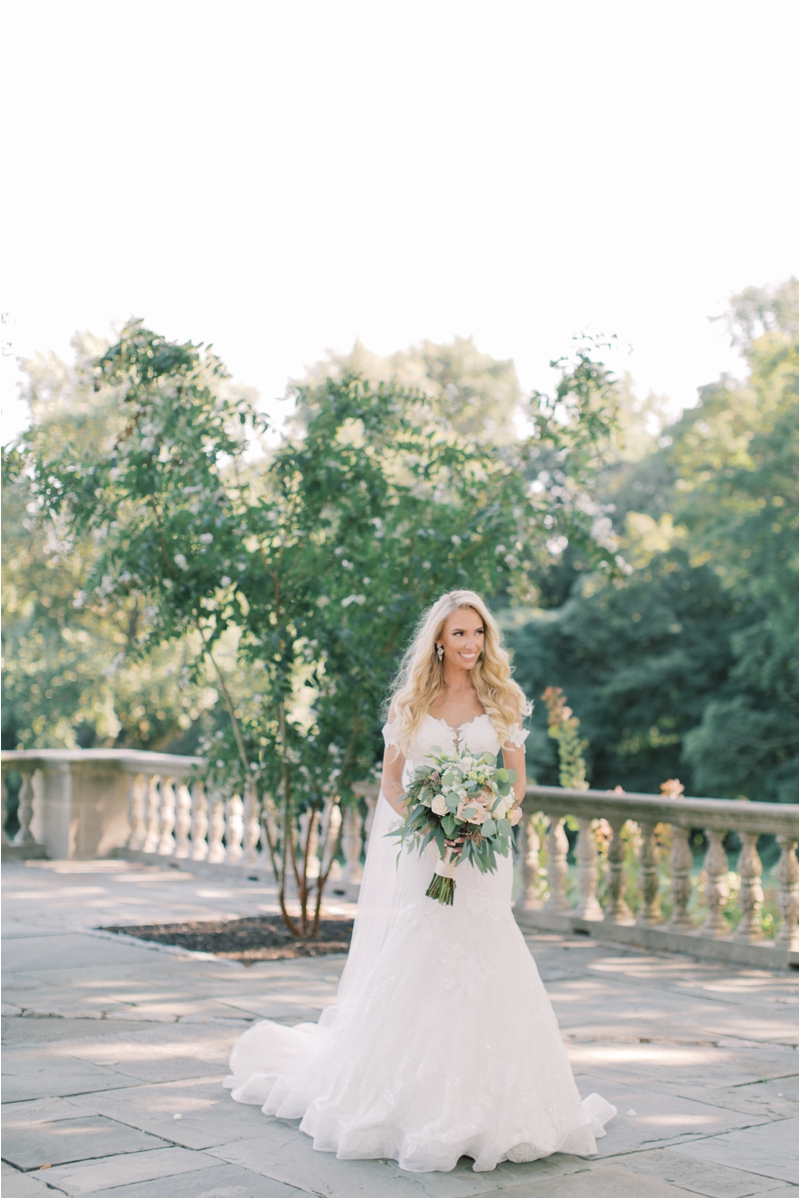 bride walks on patio at Curtis Arboretum
