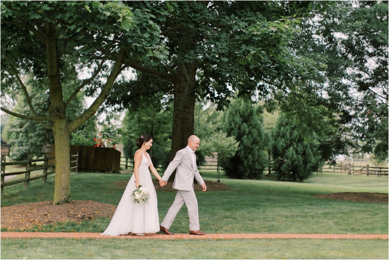 bride and groom walk on path at Ironstone Ranch