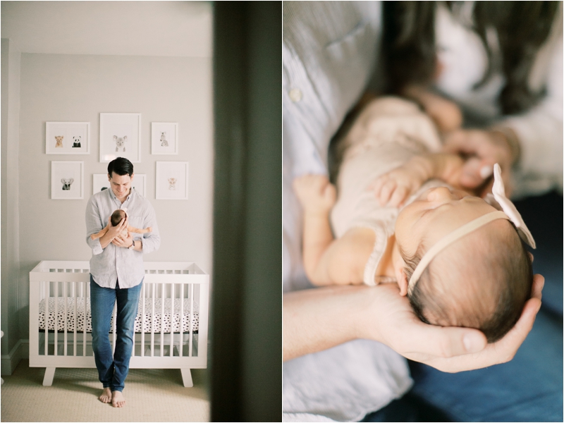 dad holds baby girl by crib during at home lifestyle newborn photos