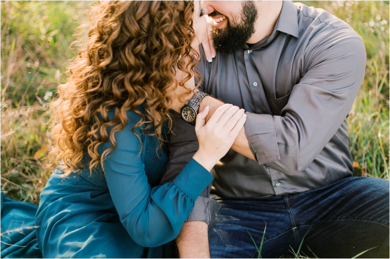 engaged couple kisses in field during PA engagement photos