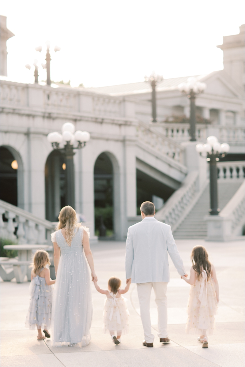 family of five walks during Harrisburg Capitol family session