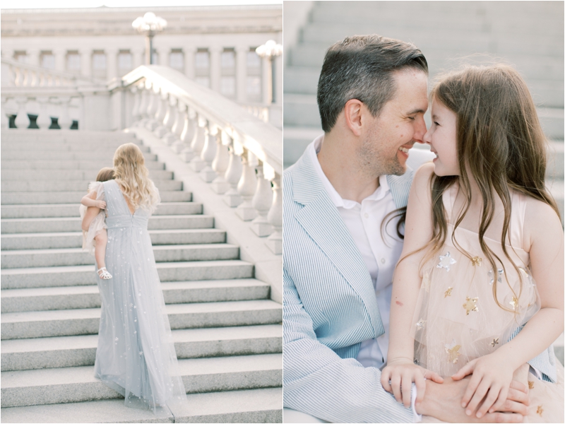 parents carry daughters during Harrisburg Capitol family photos