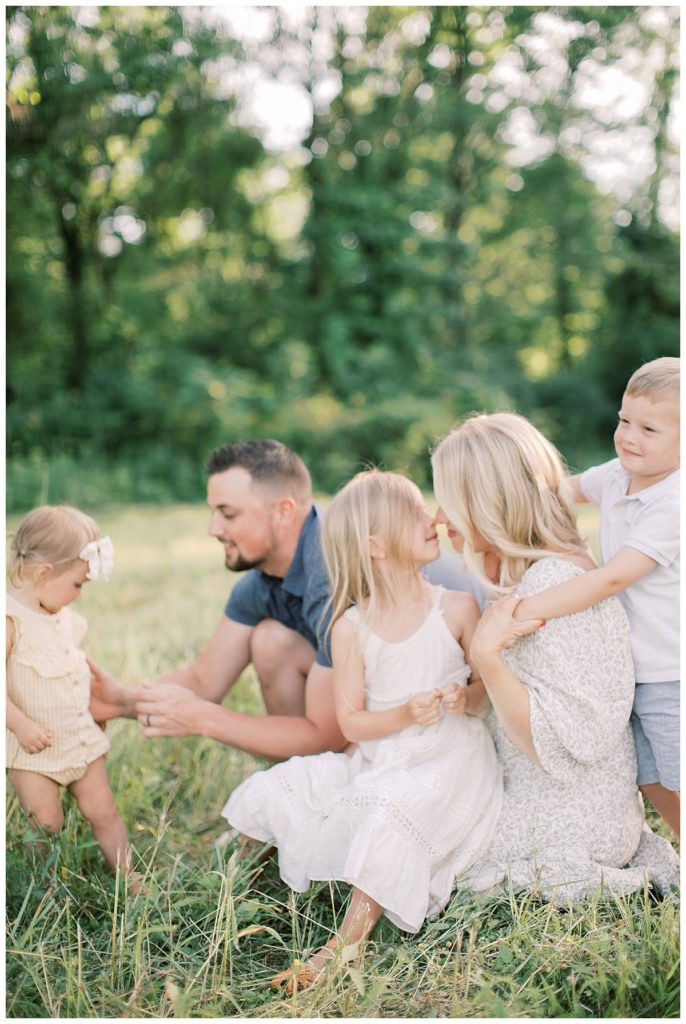 Children enjoying outdoors with parents during a photo session. Pennsylvania photographer 